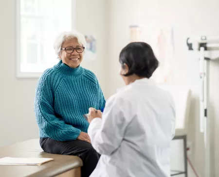 older female patient talking to doctor