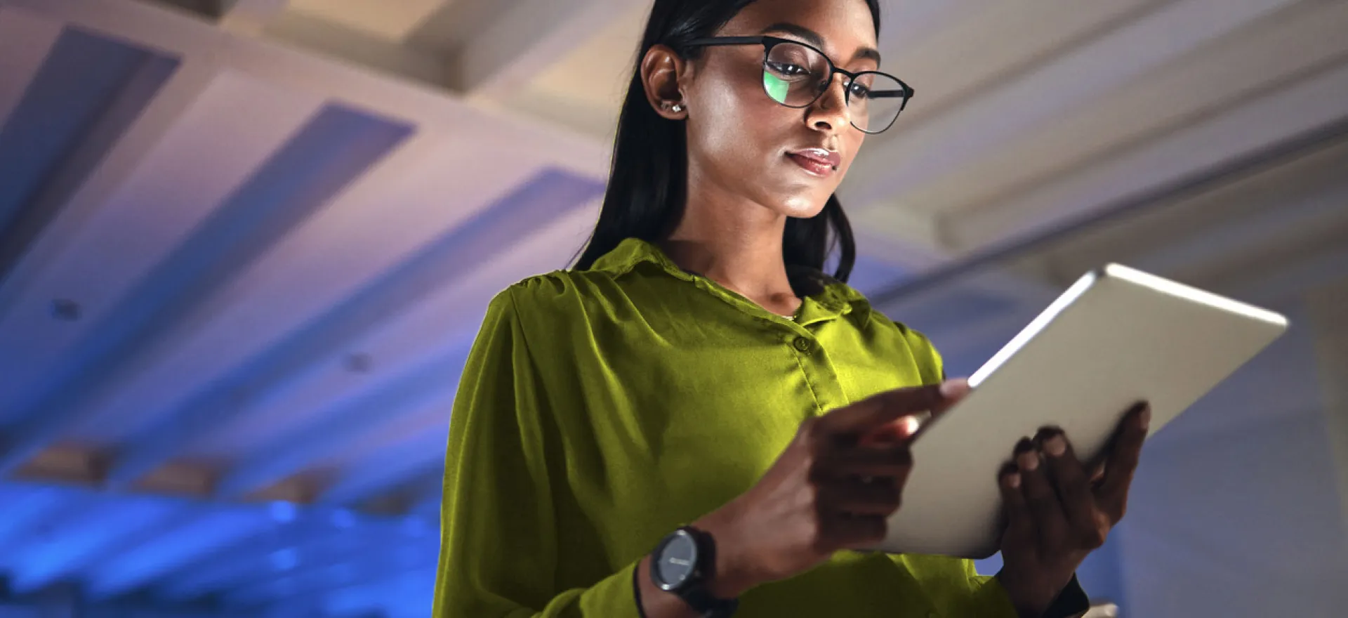 woman looking at tablet