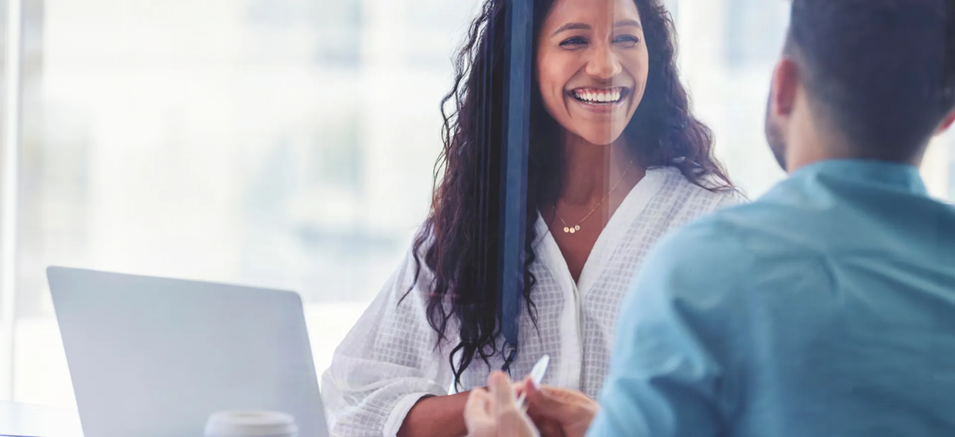 coworkers smiling at meeting