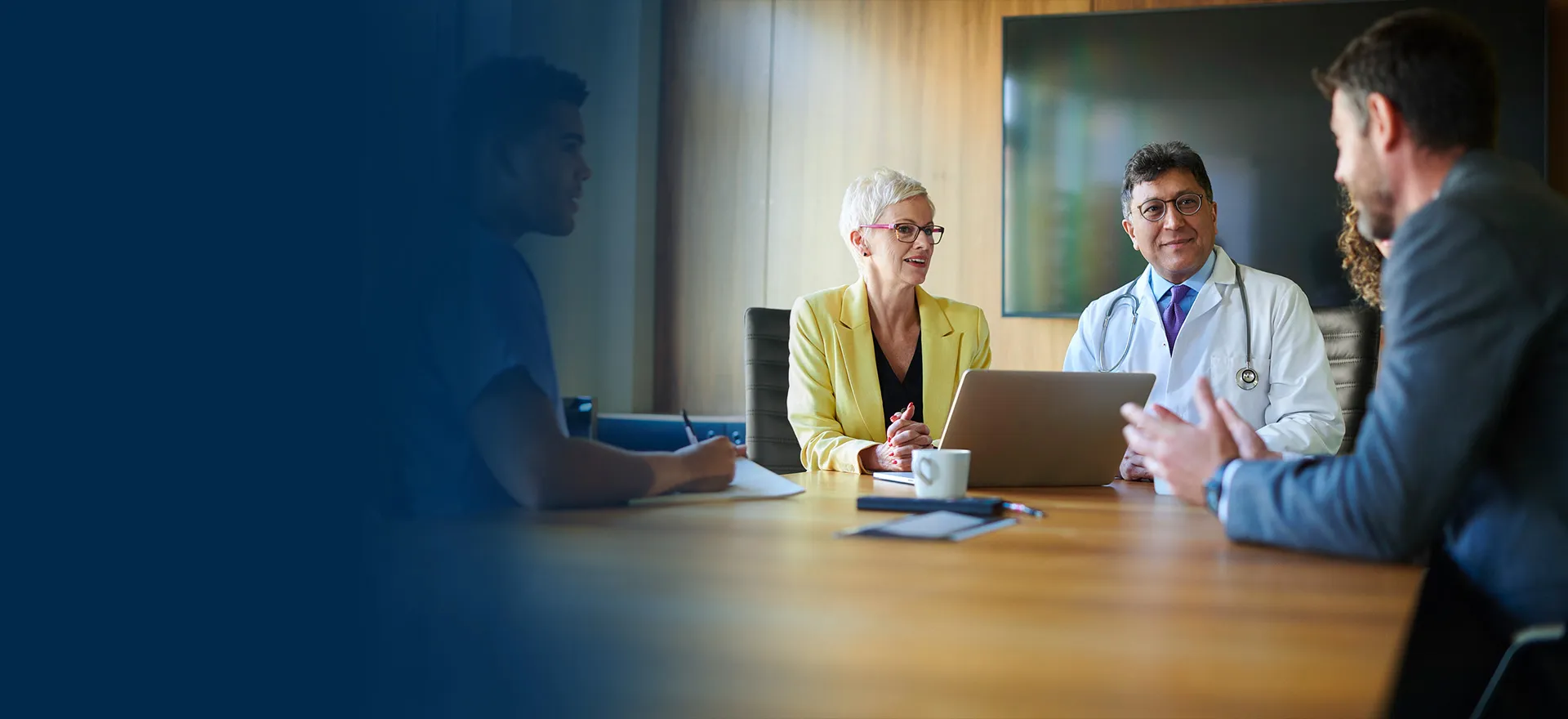 doctors and admin meeting at conference table