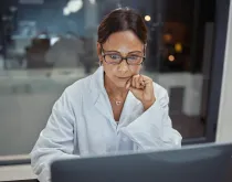 doctor working on computer in lab