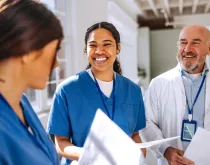 Medical workers, care team discussing while standing together at the hospital 