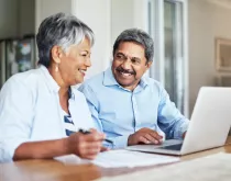 elderly couple on laptop
