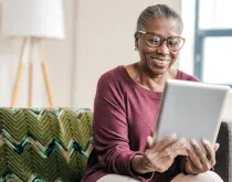 older woman on tablet