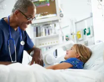 doctor with pediatric patient in hospital