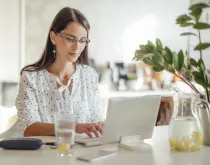 woman on laptop at table