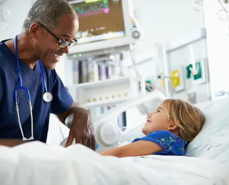 doctor with pediatric patient in hospital