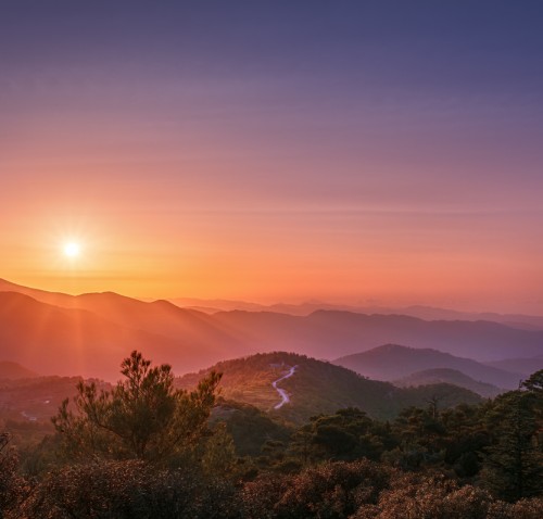 sunset over trail in mountains