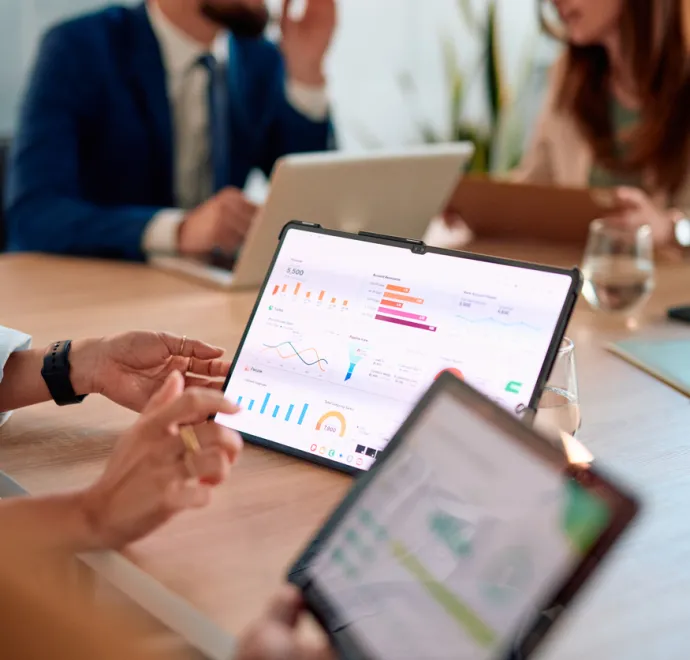 data on tablet on table during meeting