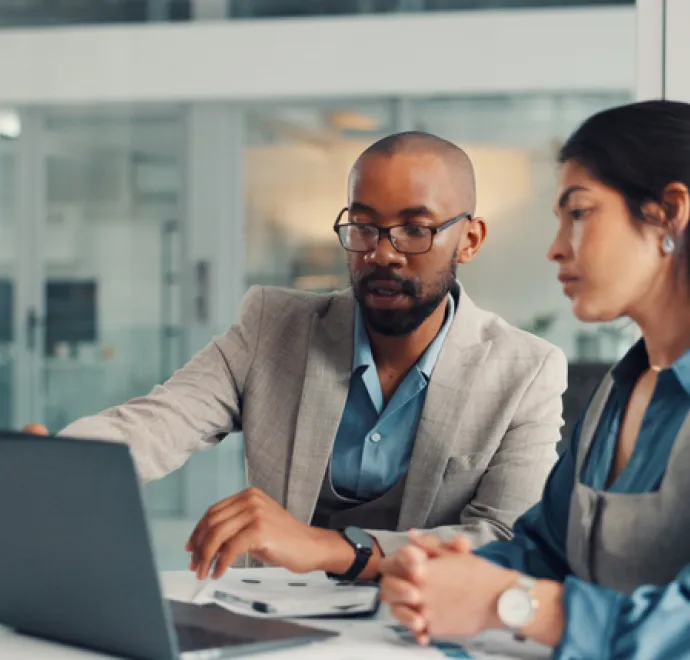 coworkers looking at computer