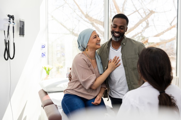 cancer patient and family with doctor