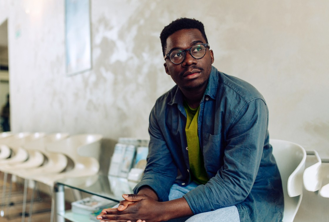 man sitting in waiting room