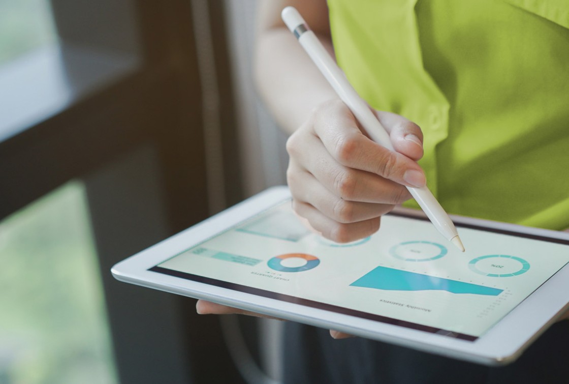 person writing on tablet