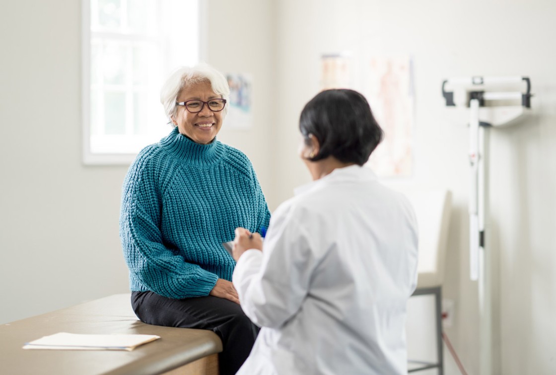 older female patient talking to doctor