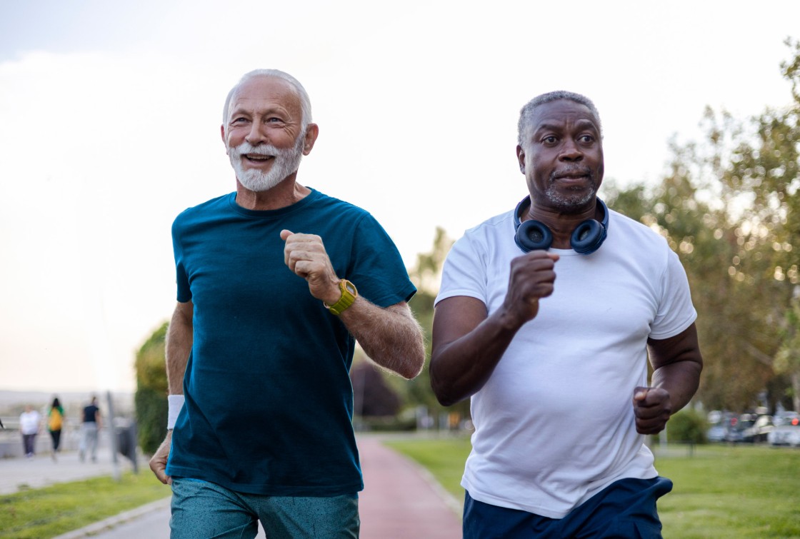 Two elderly men running