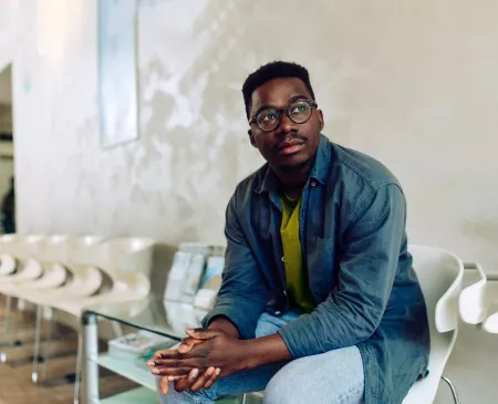 man sitting in waiting room