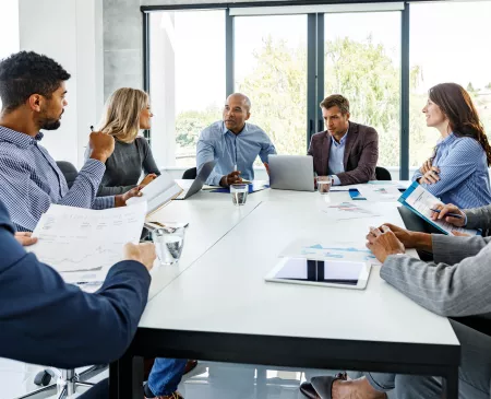 exec at a meeting using technology