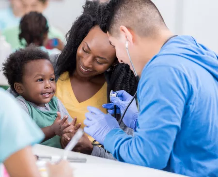 Nurse helping mom and baby