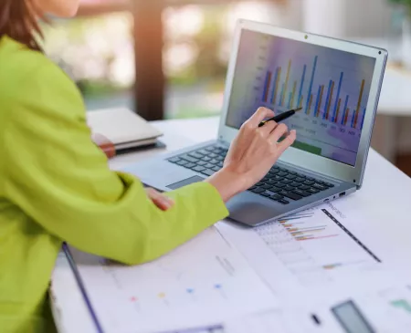 woman looking at data on computer